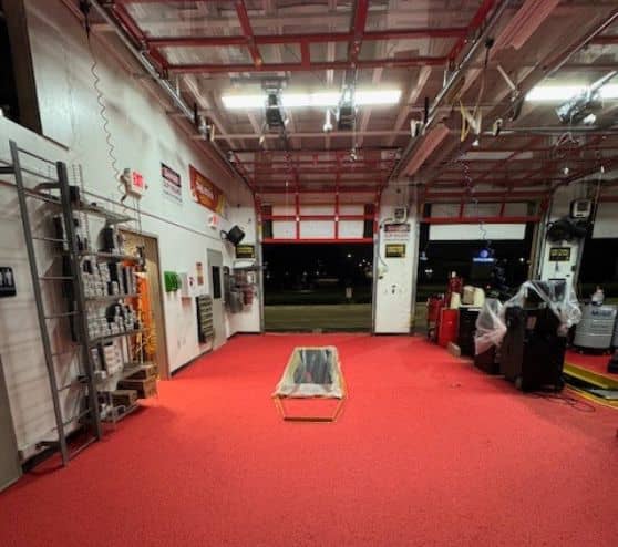 front view of solid epoxy flooring installed for take 5 oil change