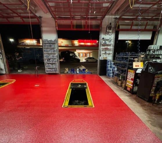 front view red solid epoxy flooring installed for take 5 oil