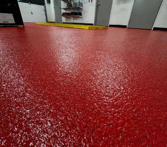 close-up of red solid epoxy for Take 5 Oil Change