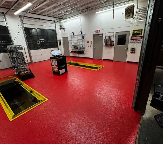 Take 5 Oil Change with solid red epoxy flooring installed