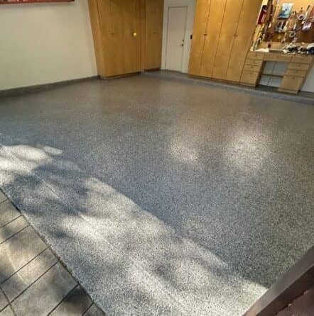 homeowner garage with new epoxy flake flooring installed