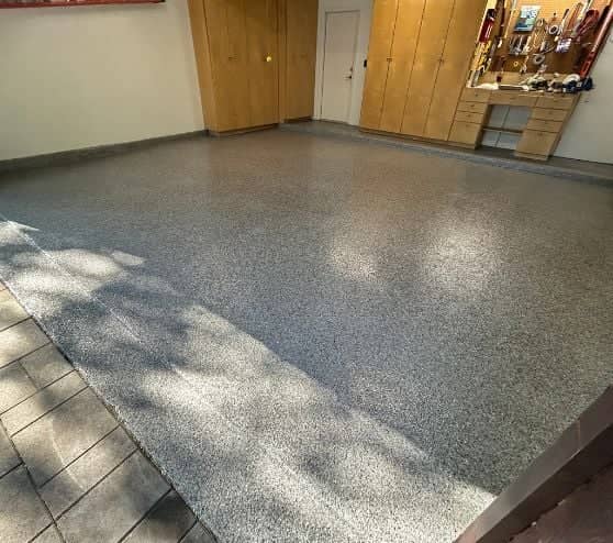 homeowner garage with new epoxy flake flooring installed