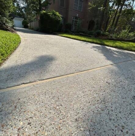 freshly sealed concrete for homeowner driveway