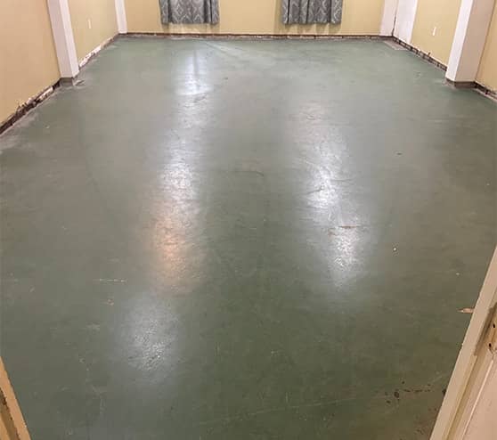 old green flooring inside of church