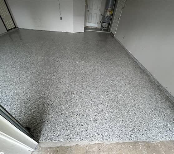 homeowner garage with new epoxy flooring installed