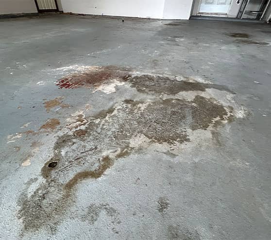 homeowner garage with chipped paint on garage floor