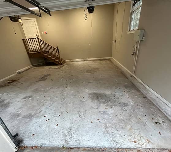 homeowner garage with stains and concrete