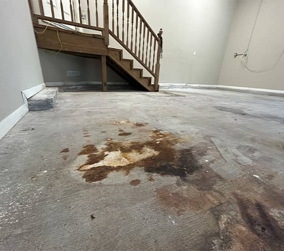 close-up of stain in middle of garage floor