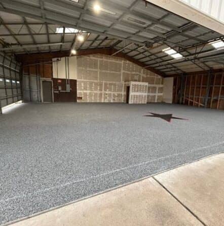 homeowner hangar with new epoxy flooring installed