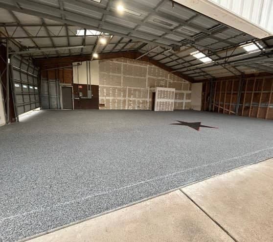 homeowner hangar with new epoxy flooring installed