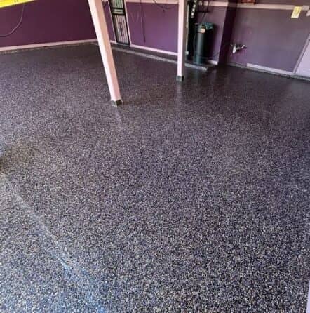 homeowner garage with new epoxy flake flooring installed