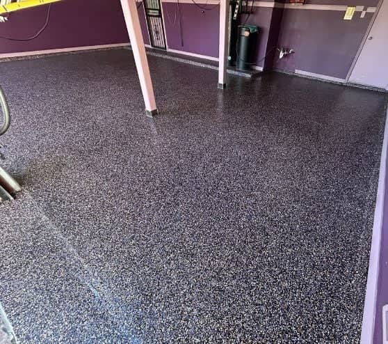 homeowner garage with new epoxy flake flooring installed