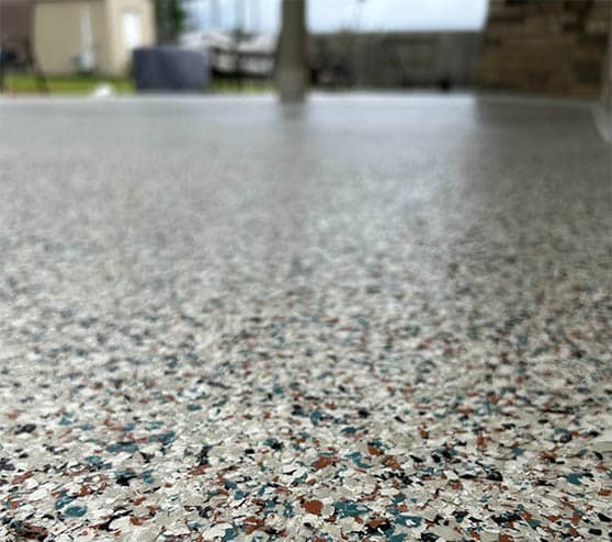 close-up of epoxy flake flooring for homeowner patio