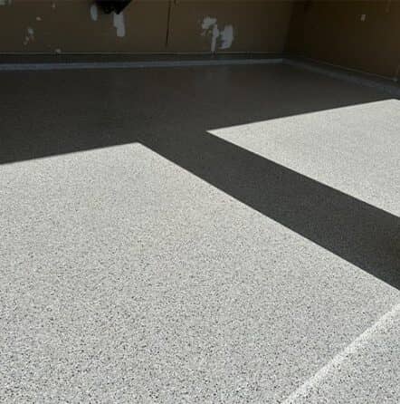 homeowner garage with new epoxy flake flooring installed