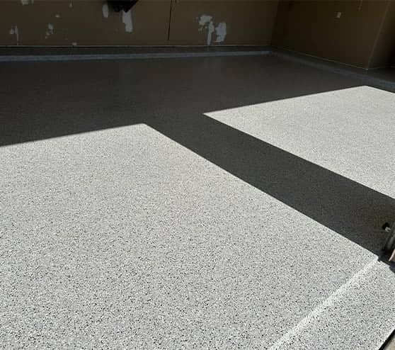 homeowner garage with new epoxy flake flooring installed