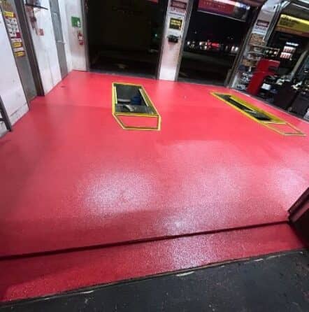 red epoxy floor installed for Take 5 Oil Change garage