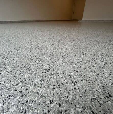 close-up of Lunar Epoxy Flake Flooring installed for homeowner garage