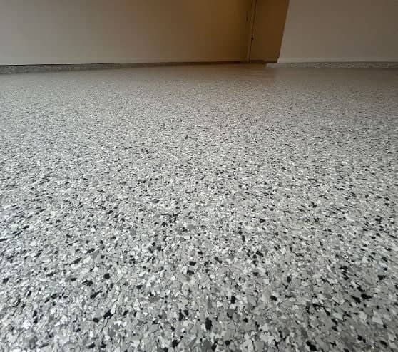 close-up of Lunar Epoxy Flake Flooring installed for homeowner garage