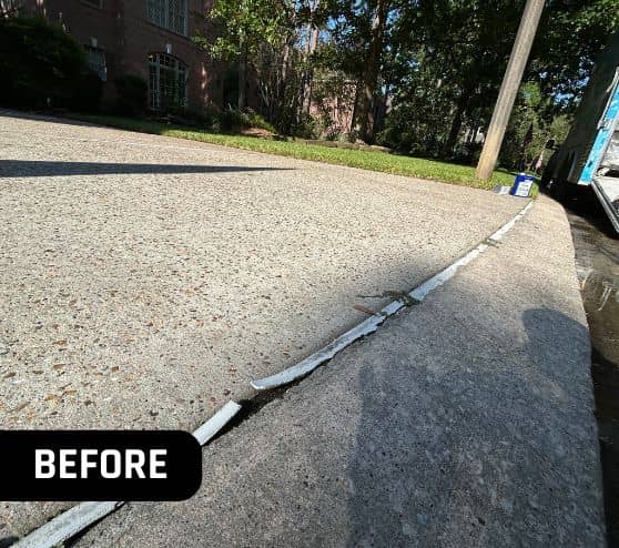 homeowner driveway before concrete sealing