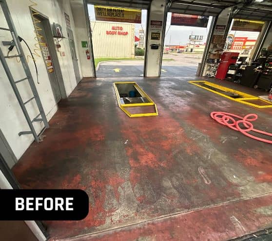 close-up of old concrete flooring inside of Take 5 Oil Change garage