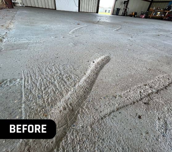 close-up of holes in concrete flooring for airplane hangar