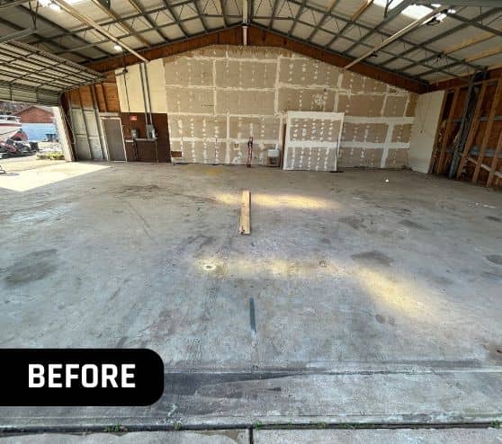 before portrait of front view of homeowner hangar with old flooring