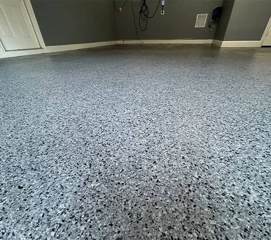 close-up of slate gray epoxy flake flooring for homeowner garage