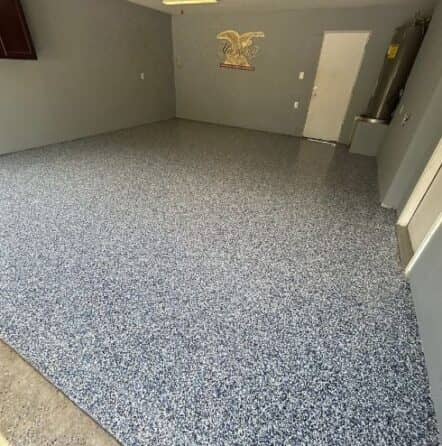 homeowner garage with new epoxy flake flooring installed