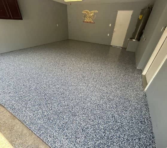homeowner garage with new epoxy flake flooring installed