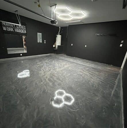 homeowner garage with new solid epoxy flooring installed