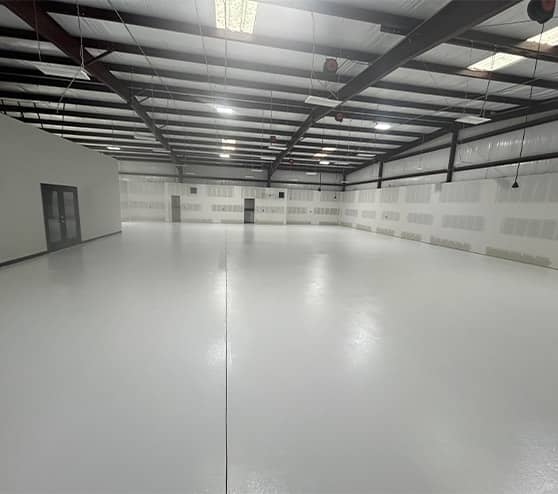 freshly poured solid epoxy flooring for Kenneth's Car Care