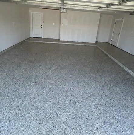 homeowner garage with fresh epoxy flake flooring