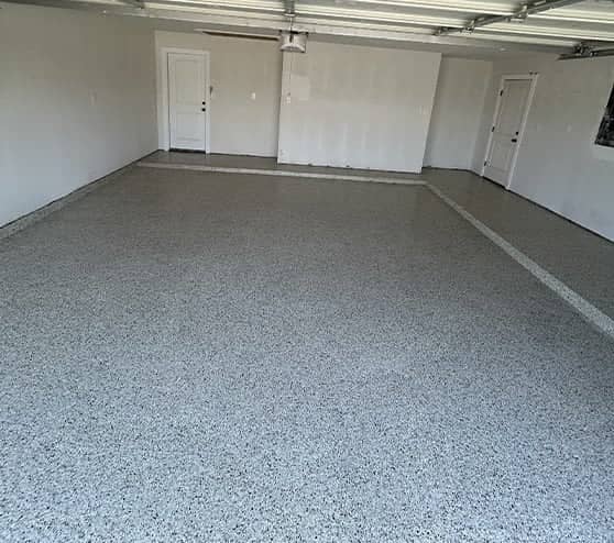 homeowner garage with fresh epoxy flake flooring