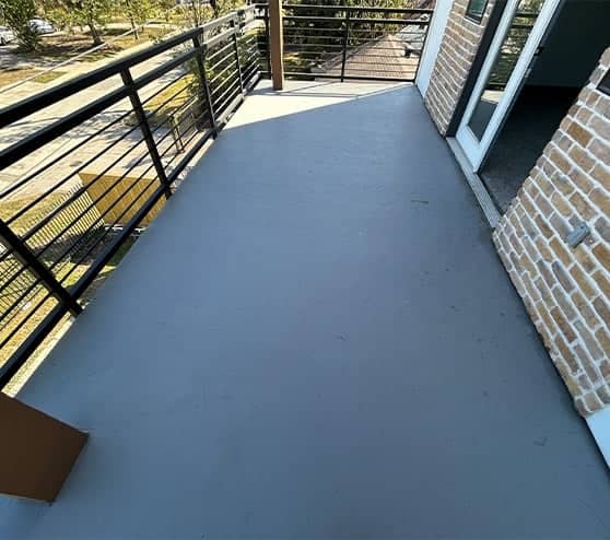 apartment balcony with new smooth concrete flooring