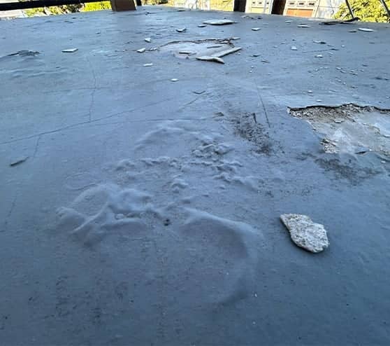 close-up of balcony flooring all torn up