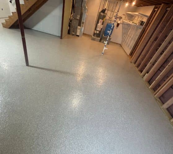 homeowner basement with new custom epoxy flake flooring installed
