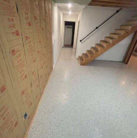 homeowner basement with new epoxy flooring installed