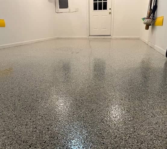 homeowner garage with new epoxy flake flooring