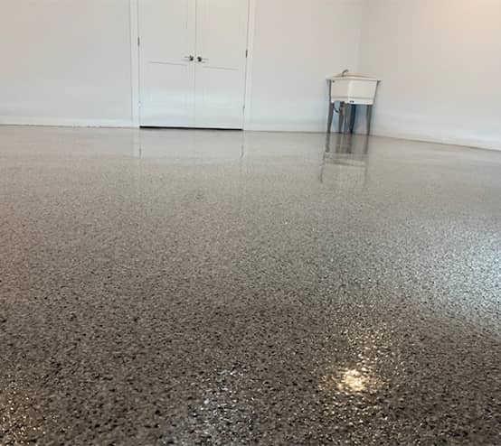homeowner garage with new epoxy flake flooring