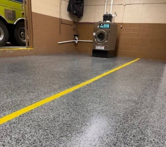 graphie epoxy flake flooring installed with line markings for Volunteer Fire Department