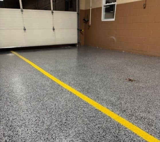 yellow line markings freshly painted for Volunteer Fire Department garage