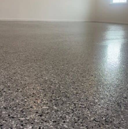 close-up of Gray Epoxy Flake Flooring installed for homeowner garage
