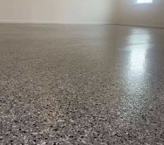 close-up of Gray Epoxy Flake Flooring installed for homeowner garage