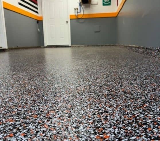 close-up of HOG Epoxy Flake Flooring installed for homeowner garage