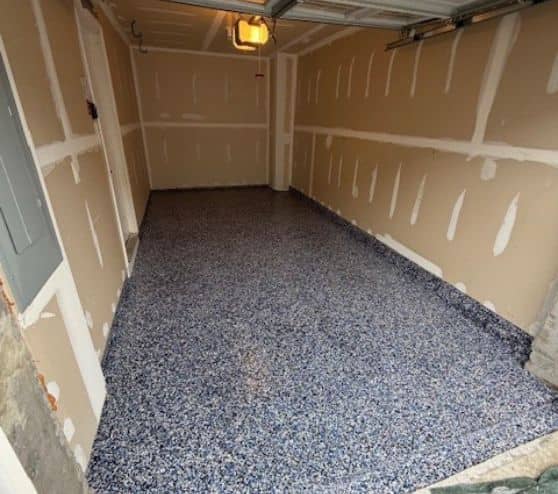 homeowner garage with new touch of blue epoxy flooring installed