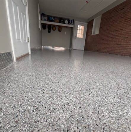 homeowner garage with new epoxy flooring installed