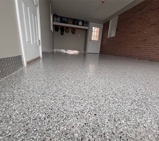 homeowner garage with new epoxy flooring installed