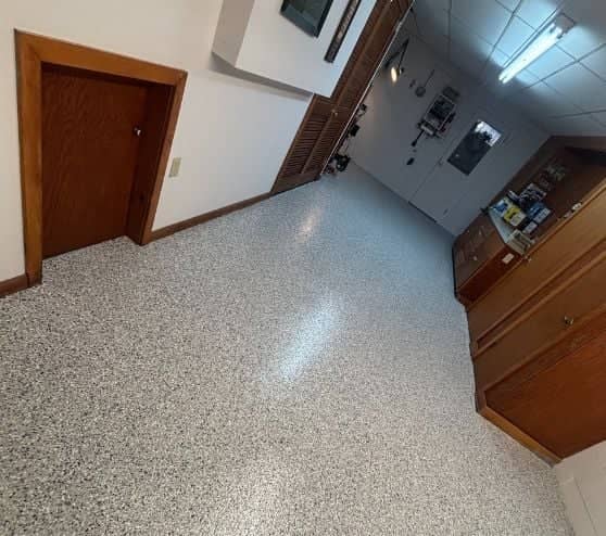 homeowner basement with tidal wave epoxy flak flooring installed