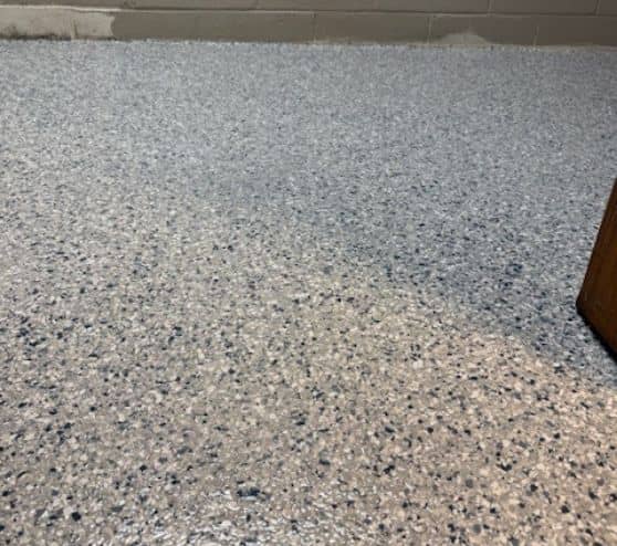 close-up of Tital Wave Epoxy Flake Flooring installed for homeowner basement