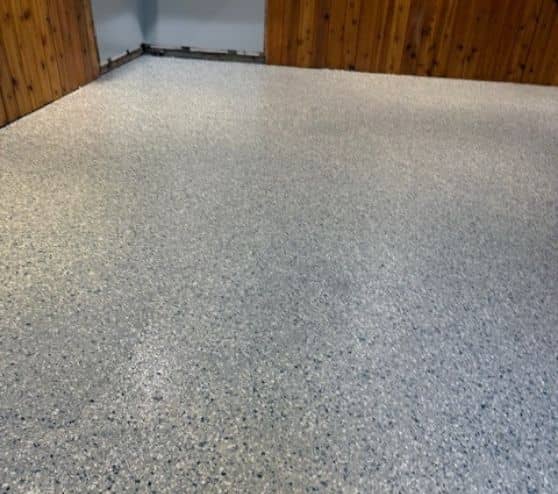 homeowner basement with new Tital Wave Epoxy Flake Flooring installed